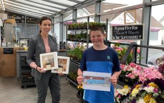Colouring Competition Winner presented with his prize