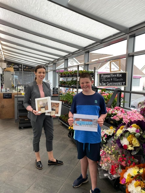 Colouring Competition Winner presented with his prize